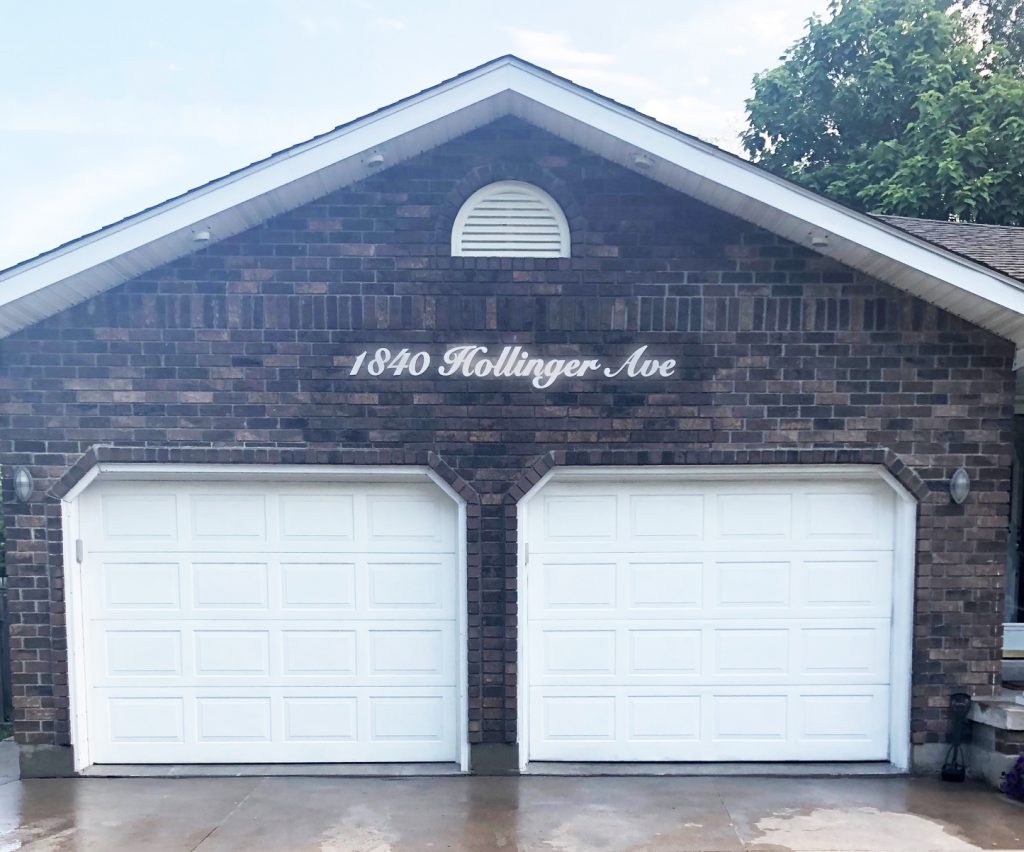 white acrylic house address with white reflective vinyl on top